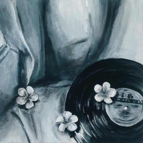 A canvas artwork of a record player and three white flowers.